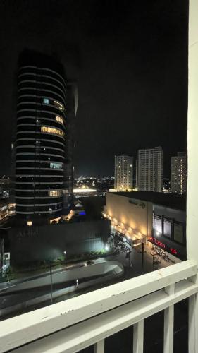 a view of a city skyline at night at Stylish and Cozy Earth-tone Studio at Inspiria with Balcony and City-View Free WiFi and Netflix beside Abreeza Mall in Davao City