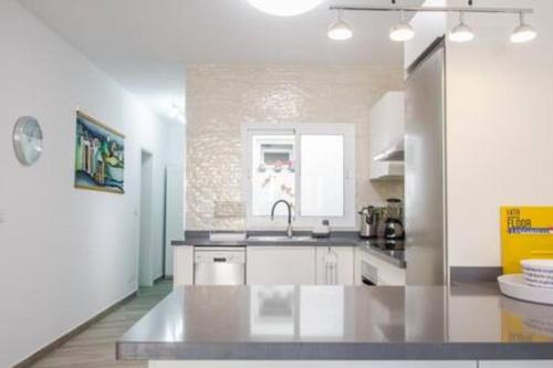 a kitchen with a sink and a counter top at La Vega de Mary in Arrecife