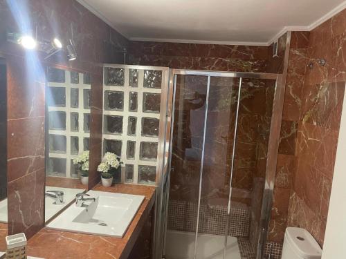 a bathroom with a shower and a sink at Nice Apartment 1210 In Central Area in San Bartolomé de Tirajana