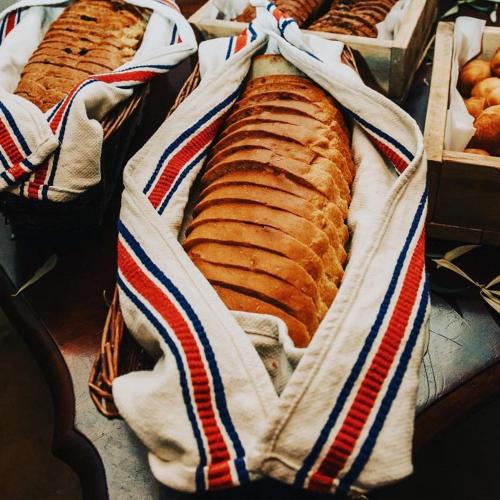 two loafs of bread sitting on a table at Thali Thali Game Lodge in Langebaan
