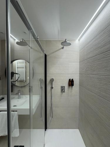 a bathroom with a shower and a sink at Hotel BCL Podium La Nucia in La Nucía