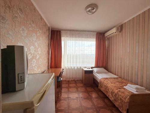 Postel nebo postele na pokoji v ubytování Tourist Poltava