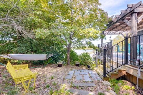 a hammock in a yard next to a house at Radford Home with Wraparound Deck! in Radford