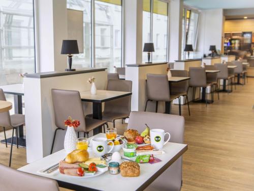 a tray of food on a table in a restaurant at B&B Hotel Nürnberg-City in Nürnberg