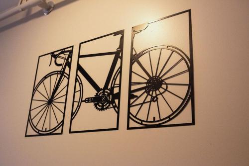 a picture of a bike hanging on a wall at 1878 RiverRun B&B - Waterfront, Self-Serve Breakfast, WiFi, Trail and River access in Hancock
