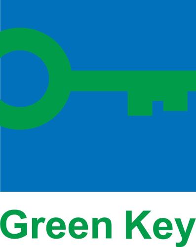 a green key with the words green key at Novotel BH Savassi in Belo Horizonte
