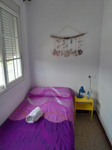 Ένα ή περισσότερα κρεβάτια σε δωμάτιο στο Casa de Amigos
