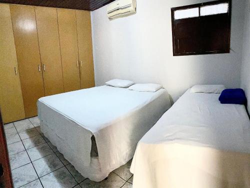 En eller flere senge i et værelse på Conforto e praticidade em Campina Grande