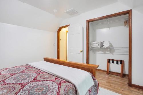 a bedroom with a bed and a mirror at Spacious 3BR with Dock on Working Farm with Pool Table in Hacksneck
