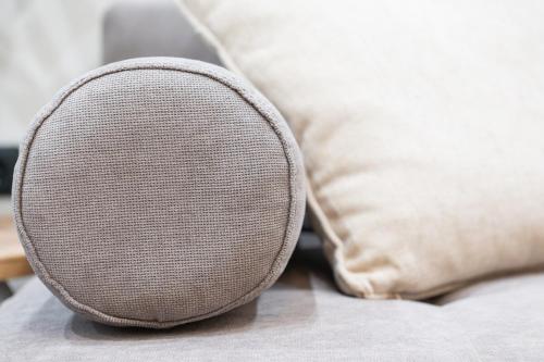 a close up of a speaker on a bed with pillows at Evis Cosmos 2 - Meno Homes 11 in Xanthi