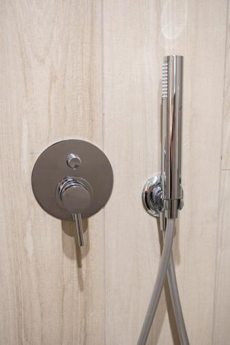 a metal door knob on a wooden door at Evis Cosmos 2 - Meno Homes 11 in Xanthi
