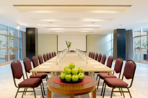 a conference room with a long table and chairs at NH City Buenos Aires in Buenos Aires