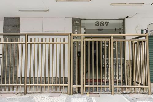 a metal gate in front of a building at SUH Copacabana 43 New Confort in Rio de Janeiro