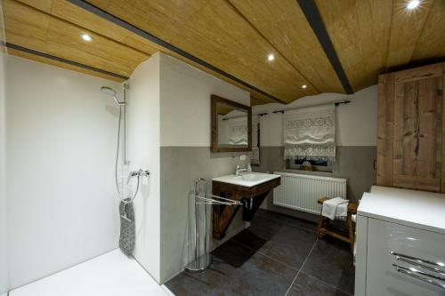 a bathroom with a sink and a shower at Ferienhaus Familie Meier in Schnaittach