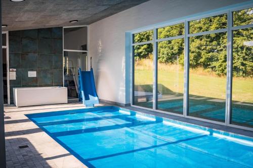 a swimming pool in a house at 8567-Grenaa-Sletten-106 in Fuglsang