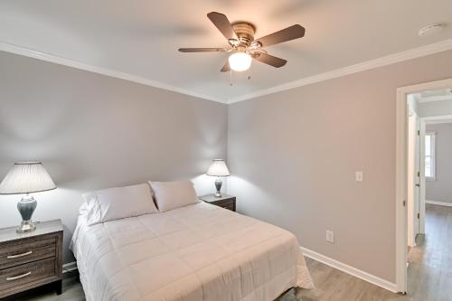 a bedroom with a bed and a ceiling fan at Hike and Explore Cheraw Apt 7 Mi to Lake Juniper! in Cheraw