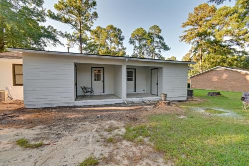 a white house with a yard at Hike and Explore Cheraw Apt 7 Mi to Lake Juniper! in Cheraw