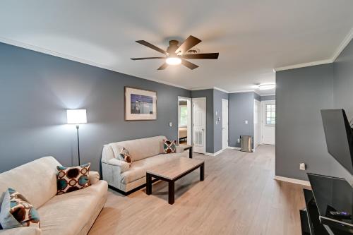a living room with a couch and a ceiling fan at Private Patio Apt 6 Mi to Cheraw State Park! in Cheraw