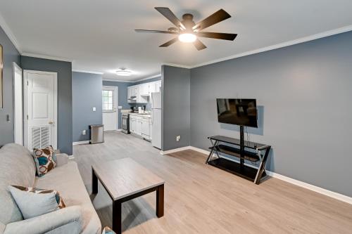 a living room with a couch and a flat screen tv at Private Patio Apt 6 Mi to Cheraw State Park! in Cheraw
