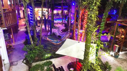 an overhead view of a garden with purple lights at Poshtel Arenal in Fortuna
