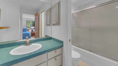 a bathroom with a sink and a shower at Shadow - Unit 1 in Sunriver