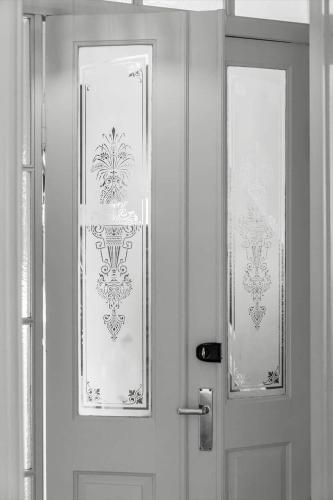 a white door with two windows on it at FY399-Bogense-Ostergade-5-a in Bogense