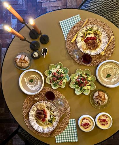 a table with plates of food on top of it at Le Numéro 10 in Bernis