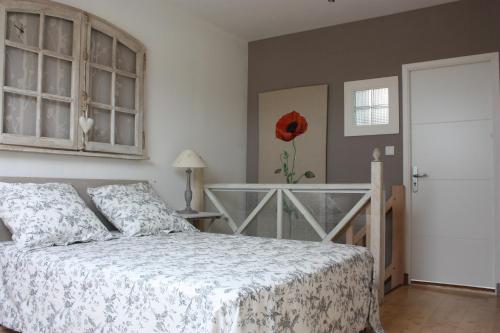 Ένα ή περισσότερα κρεβάτια σε δωμάτιο στο Chambre d'hôtes face à Briare