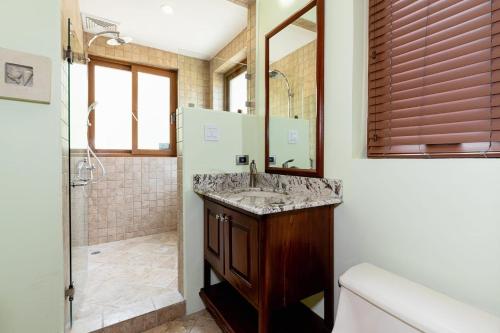 a bathroom with a sink and a shower at Sol Y Mar 4c in Playa Hermosa