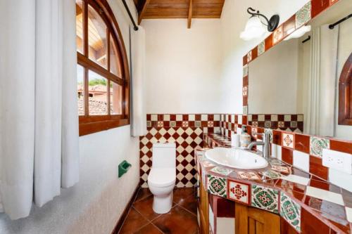 a bathroom with a sink and a toilet at Casa Amarilla in Playa Hermosa