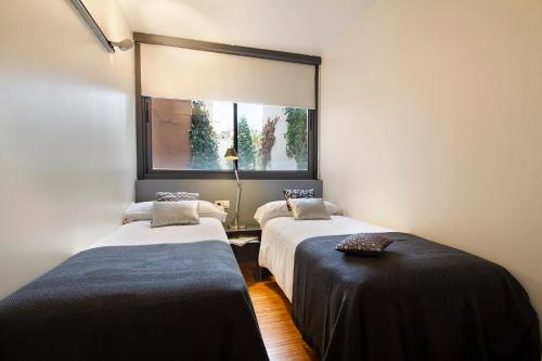 Postel nebo postele na pokoji v ubytování Apartment Barcelona Rentals - Park Güell Apartments
