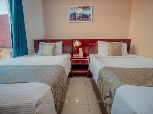 Postel nebo postele na pokoji v ubytování Hotel Palacio