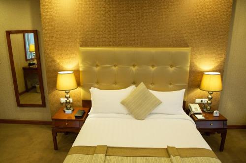 Ένα ή περισσότερα κρεβάτια σε δωμάτιο στο Jupiter International Hotel - Cazanchis