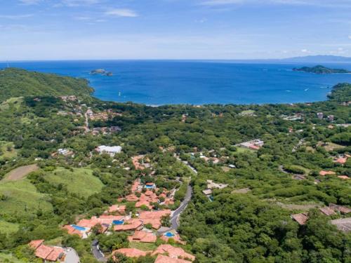 an aerial view of a village and the ocean at Casa Texvol in Playa Hermosa