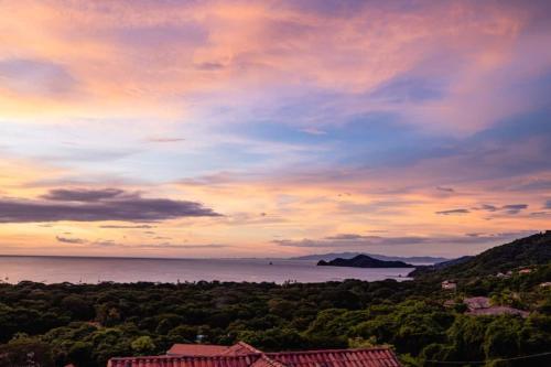 a view of the ocean at sunset at Casa Texvol in Playa Hermosa