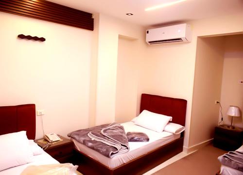 Cama o camas de una habitación en فندق أجياد Agyad Hotel