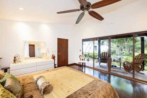 a bedroom with a bed and a ceiling fan at Little Dubai in Coco