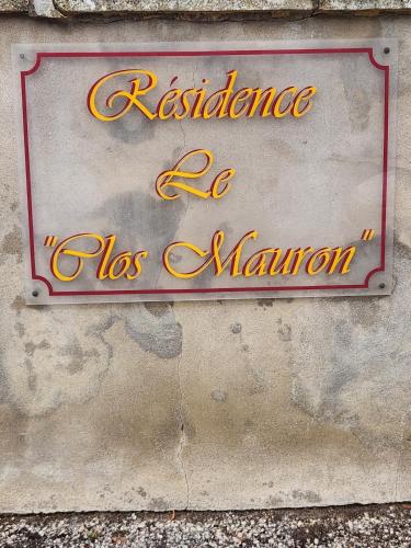 a sign on the side of a building at Le Clos Mauron Numéro 13 in Gray-la-Ville