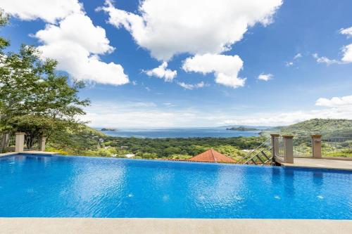 a swimming pool with a view of the ocean at Casa Antonelli in Playa Hermosa