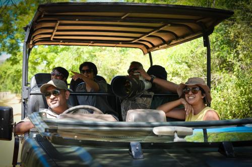 a group of people riding in a jeep at Ceylon Wild in Kataragama