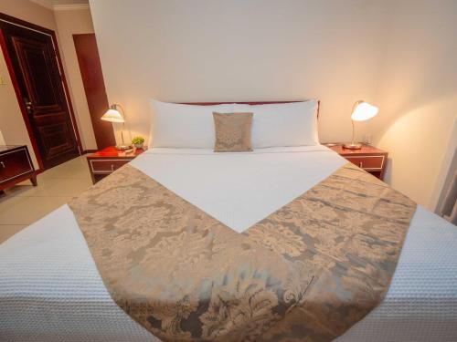 Postel nebo postele na pokoji v ubytování Hotel Palacio