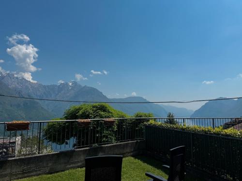 a balcony with a view of the mountains at La Gioiosa apartment with garden terrace in Civenna