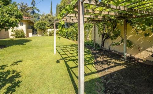 a pergola in the yard of a house at Beautiful house in the best neighborhood in Fresno