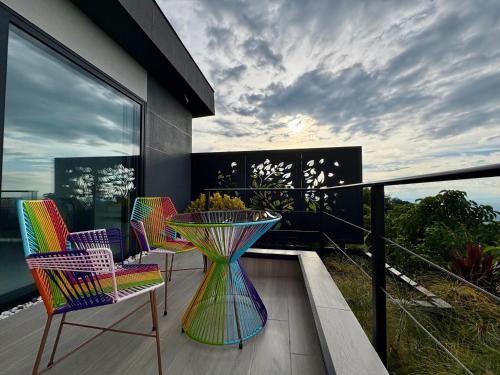 a balcony with a table and chairs on a balcony at La Font Ecolodge in Buenavista