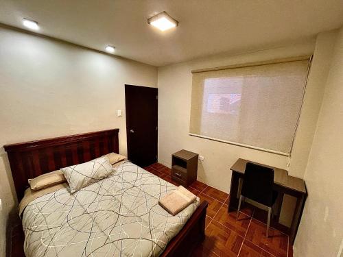 Ένα ή περισσότερα κρεβάτια σε δωμάτιο στο Apartamento en Loja