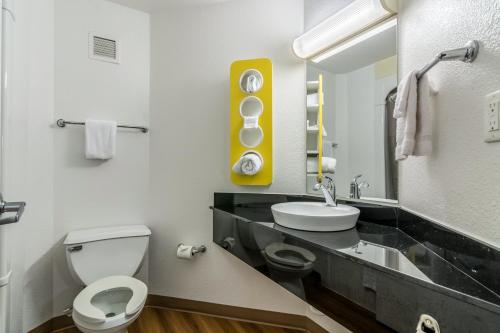 a bathroom with a white toilet and a sink at Motel 6 Fort Mill, SC - Charlotte in Fort Mill