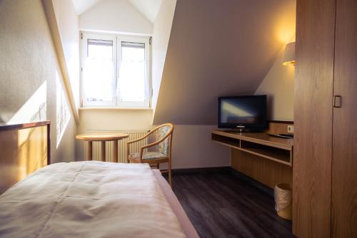 Televisyen dan/atau pusat hiburan di Hotel Cafe Kern