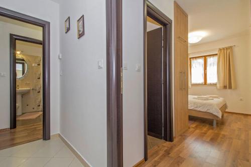 a room with a bedroom with a bed and a mirror at Lucia in Gračišće - Istrien in Gračišće