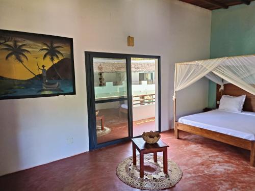 Katil atau katil-katil dalam bilik di Auberge SAKATI'Art