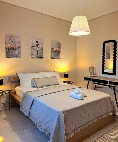 a bedroom with a large bed and a piano at Stelina's Guest House in Trikala in Tríkala
